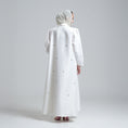 Load image into Gallery viewer, Woman wearing a long white dress
